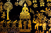 Wat Xieng Thong temple in Luang Prabang, Laos. Detail of the  intricate gold stencilling on black lacquer that decorate the walls of the sim. Detail of the 'battle of Mara' from Buddhist Jataka 